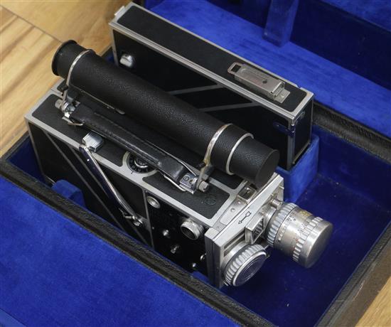 A Cine-Kodak Special II camera with accessories and travel case.